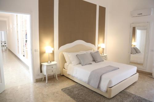 a hotel room with a bed and a dresser at Dimi House in Lecce