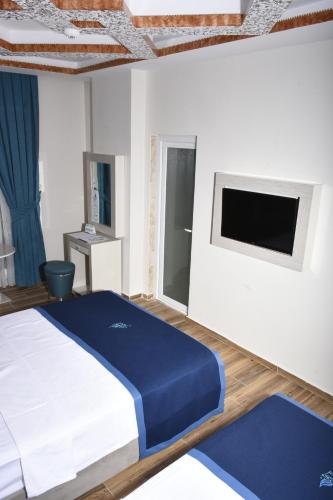 Katil atau katil-katil dalam bilik di Avesis Hotel