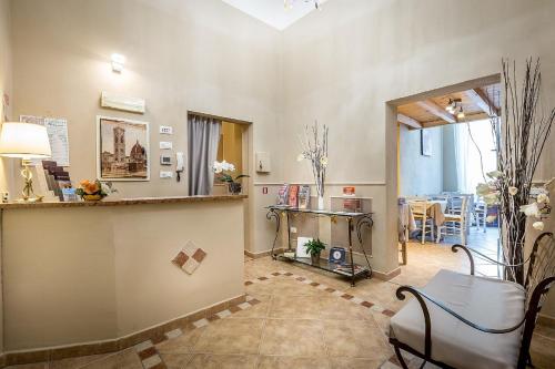 a living room with a counter and a dining room at Sognando Firenze in Florence