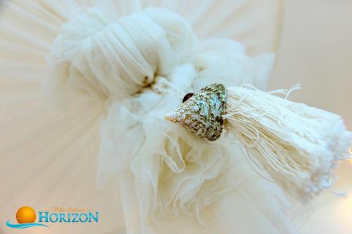 a close up of a wedding dress with a ring on it at Villa Infinite Horizon in Amed