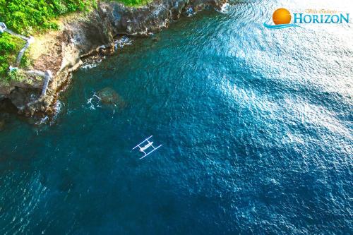 an aerial view of a boat in the water at Villa Infinite Horizon in Amed