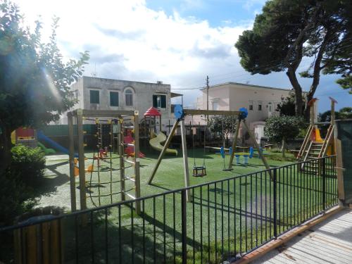 a playground with slides and swings at Capri Dreaming in Anacapri