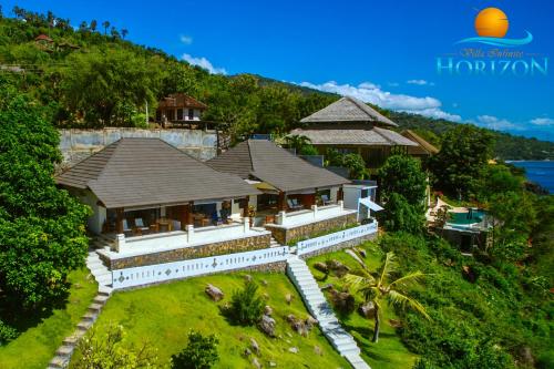 an aerial view of a house on a hill at Villa Infinite Horizon in Amed