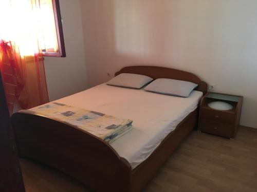 מיטה או מיטות בחדר ב-Apartman Donjerković Prižba, Blato