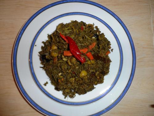 a plate of food on a wooden table at Citadelle Gorges in Ait Ben Ali