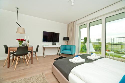 Katil atau katil-katil dalam bilik di BlueApart Apartamenty Na Plaży Jastarnia