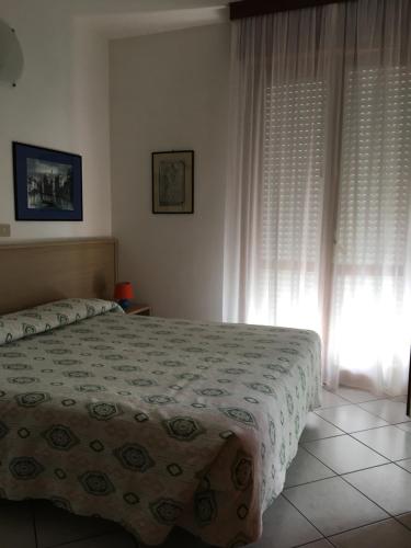 Кровать или кровати в номере Residence Moresco