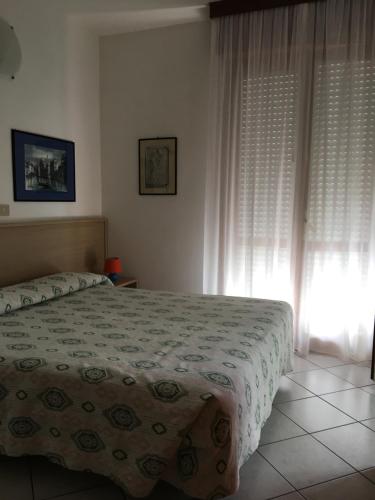 Ένα ή περισσότερα κρεβάτια σε δωμάτιο στο Residence Moresco