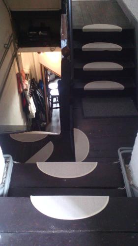 a stairway with white circles on the floor at Schuttershof Heerlen - Adults Only in Heerlen