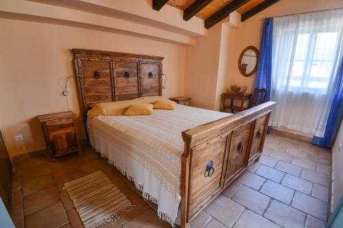a bedroom with a bed and a wooden dresser at Kazanegra Exclusive Apartments in Sveti Stefan