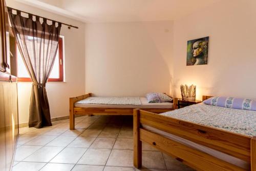 Tempat tidur dalam kamar di Apartmenthaus Mira Eldic