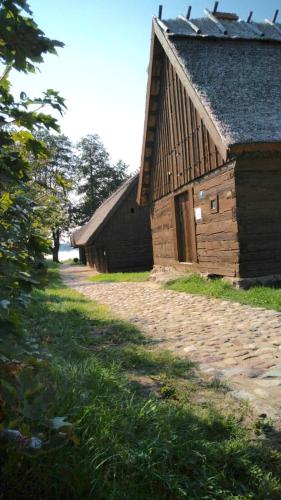 a couple of barns sitting next to each other at Sominy Urlop na Kaszubach in Sominy
