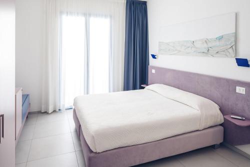 Postel nebo postele na pokoji v ubytování B&B El Gatt