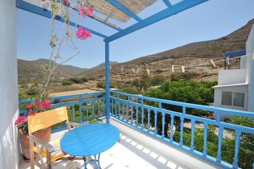 a view from the balcony of a house with a table and chairs at Pension Sofia Amorgos-Katapola in Katapola
