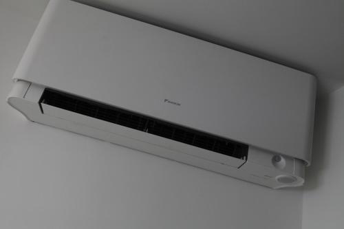 a computer monitor hanging on a wall at Exhibition Court Hotel 4 in London