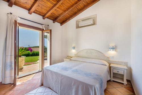 Postel nebo postele na pokoji v ubytování Hotel Costa Caddu