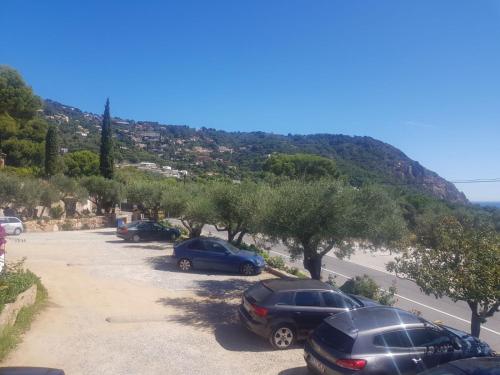 a group of cars parked in a parking lot at Hostal Ondina in Begur