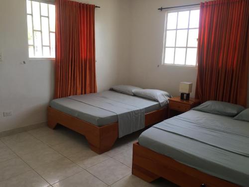מיטה או מיטות בחדר ב-Apartamentos Rocky Cay Bay