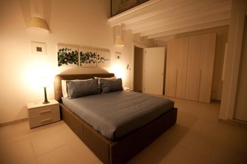 Кровать или кровати в номере Italiana Resort Maniace