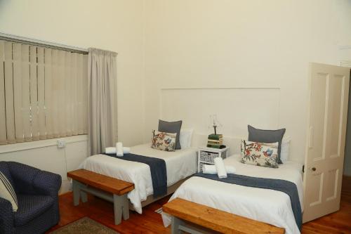 Ένα ή περισσότερα κρεβάτια σε δωμάτιο στο Die Hoekhuis