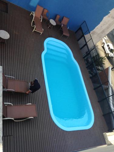 a large swimming pool on the roof of a building at FortalezAmar Hotel Praia Mansa in Fortaleza