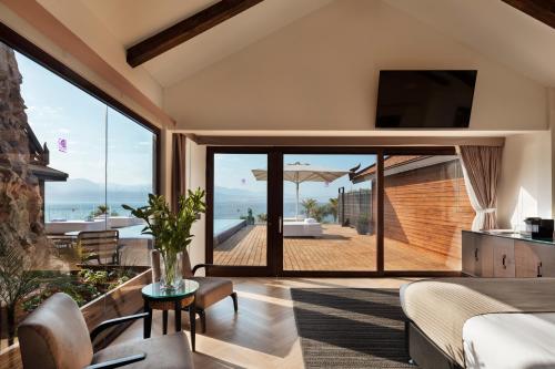 a bedroom with a view of the ocean at Orchid Eilat Hotel in Eilat