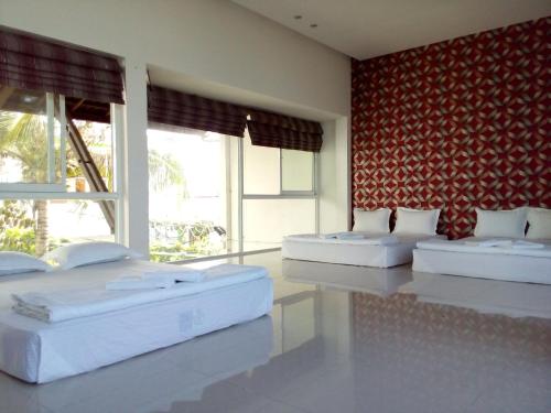 Säng eller sängar i ett rum på Mekong Hotel & Restaurant