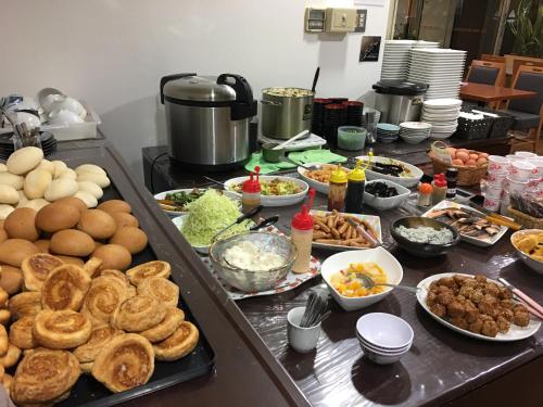 a buffet with many different types of food on a table at Ace Inn Matsusaka in Matsuzaka
