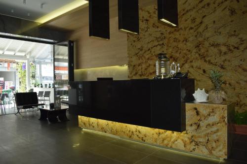 a lobby of a restaurant with a reception desk at Hotel Zefyros in Paralia Katerinis