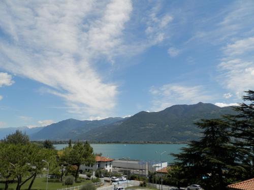 a view of a large body of water with mountains at Continental Hotel in Lovere