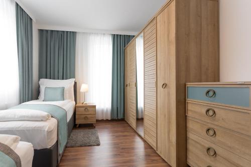 Mar Suite Apartments - Simmering 객실 침대