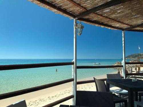 a view of the beach from a restaurant at Abamar Hotel in Santa Margherita di Pula