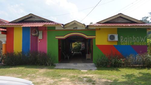 a colorful house with a rainbow guest house at Taman negara rainbow guest house in Kuala Tahan