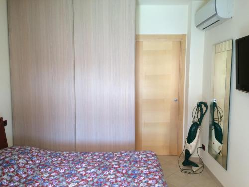 a bedroom with a bed and a tv at Lido delle Farfalle in Casalbordino