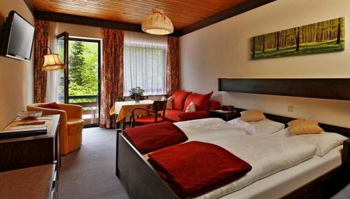 En eller flere senge i et værelse på Alpenpension Birkenhof