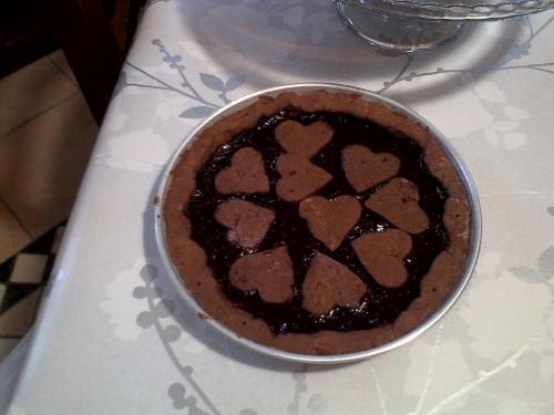 a chocolate pie sitting on a table at LA CASA DEI MASUE' in Alba