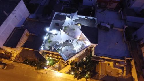 an overhead view of a building with a large white building at B&B Luxury in Lecce