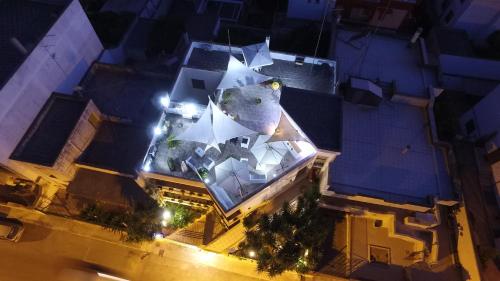 an overhead view of a building with an umbrella at B&B Luxury in Lecce