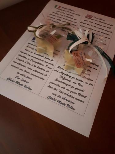 a piece of paper with two tags on it at Chalet Monte Nebius in Vinadio