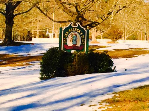 a sign in the snow in a park at Innkeeper's Place B&B in Stafford Springs