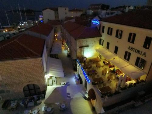 an aerial view of a building at night at Apartments Residence Astoria in Rab