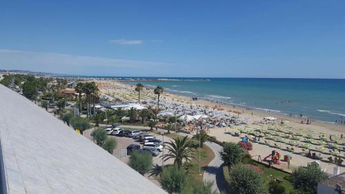 a view of a beach with a crowd of people at Kiara Residence in Giulianova