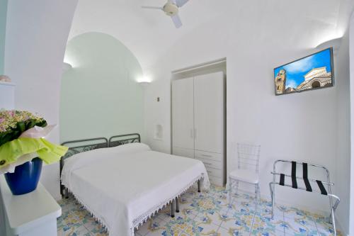 Ένα ή περισσότερα κρεβάτια σε δωμάτιο στο Relais San Basilio Convento