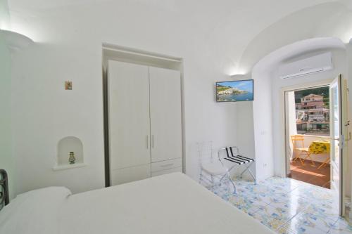 Ένα ή περισσότερα κρεβάτια σε δωμάτιο στο Relais San Basilio Convento