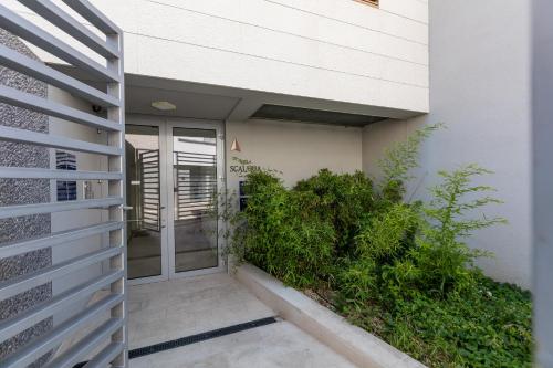 an entrance to a building with a glass door at Luxury Apartment Kampanel in Split