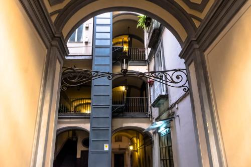 a stairway leading to a building with a large window at Per Amor Duomo in Naples