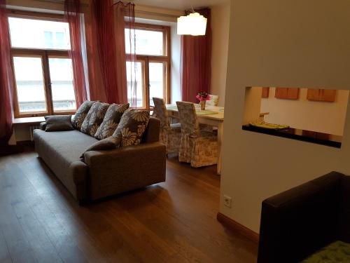a living room with a couch and a table at Old Town Apartment in Tallinn
