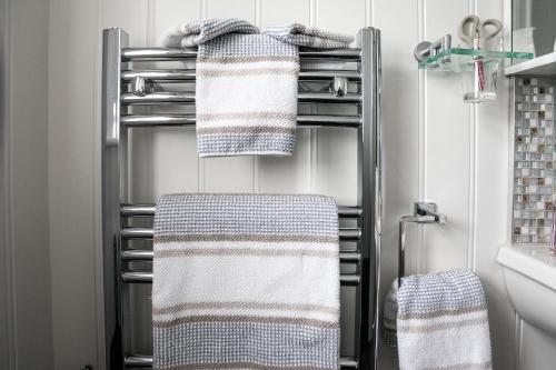 two towels on a towel rack in a bathroom at Anvershiel House in Portrush