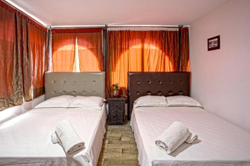 En eller flere senge i et værelse på Hotel Agnaoue