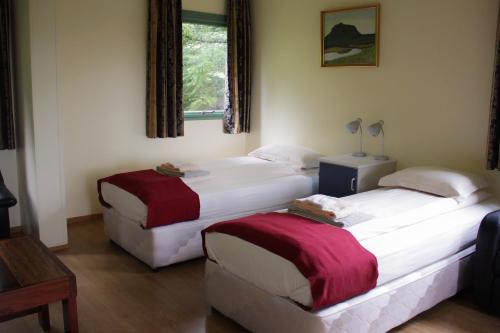 Postel nebo postele na pokoji v ubytování Guesthouse Svartiskógur Egilsstaðir
